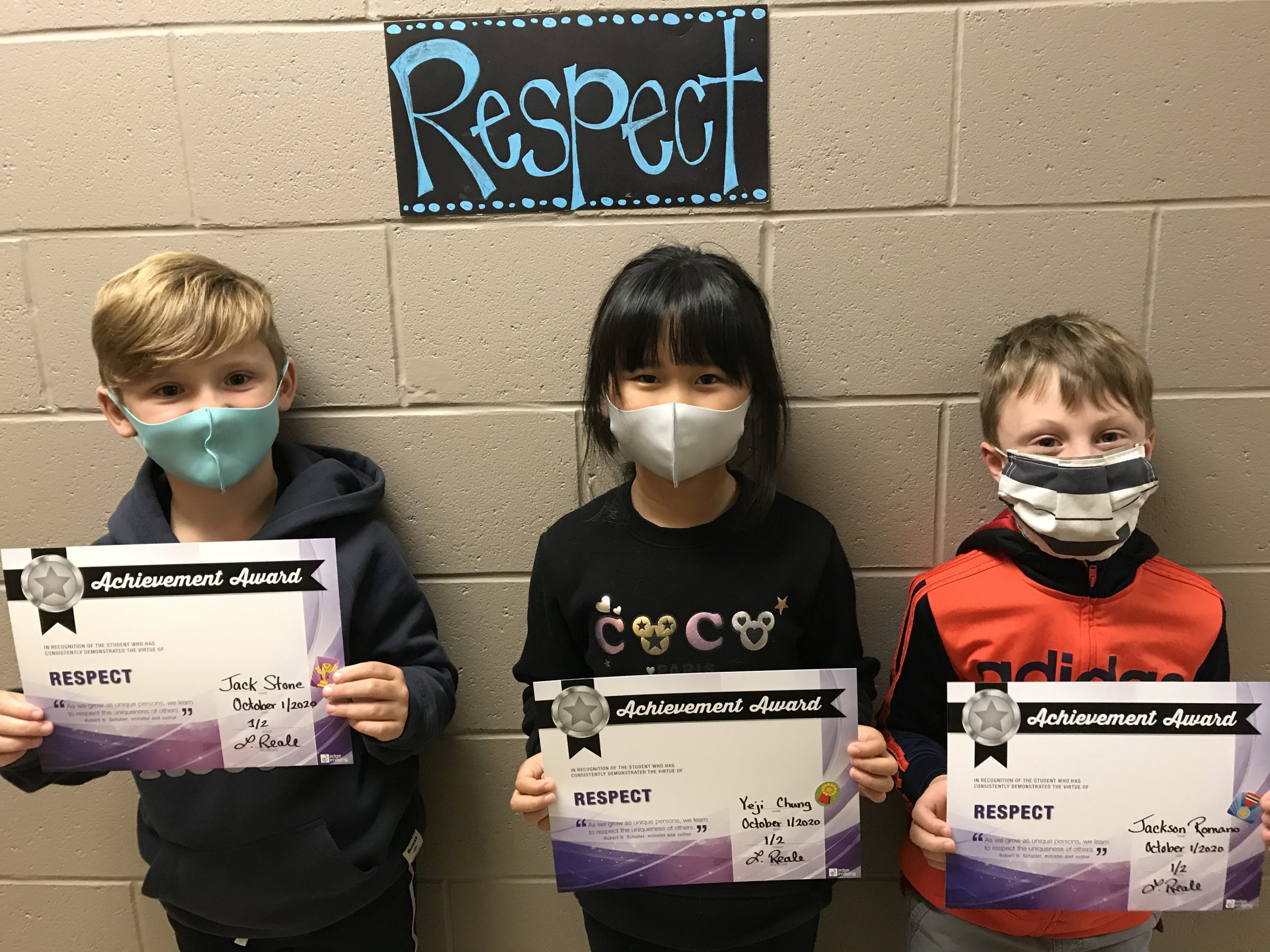 Students holding up Respect certificates